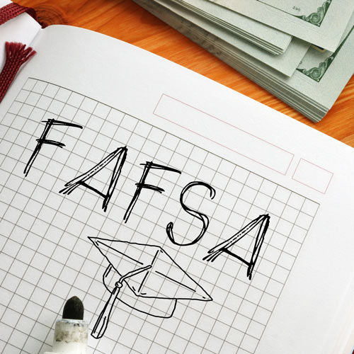 The words FAFSA is sketched on graph paper along with a graduation cap