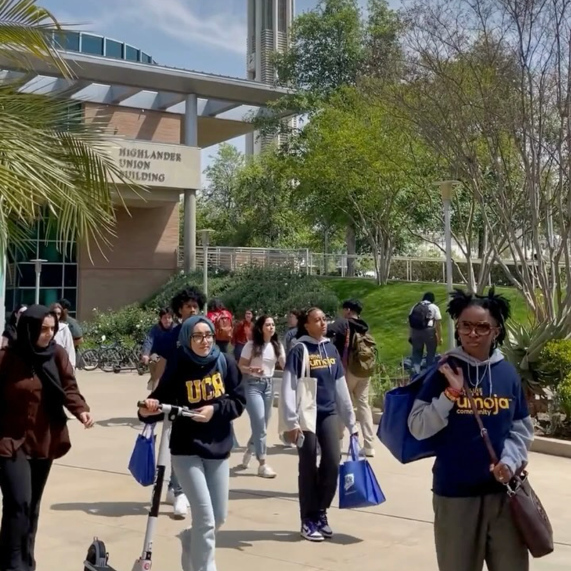 Students walk outside the Highlander Union Building on the UC Riverside campus.